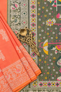 Anvika semi raw silk saree with coral peach and olive tones and resham weaving by Tattva Crafted Elegance