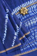 Neelika indigo Shibori Lehariya Chanderi silk cotton saree with golden zari border by Tattva Crafted Elegance.