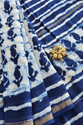 Mihika indigo hand block printed silk cotton saree featuring traditional paisley motifs, striped patterns and golden zari border by Tattva Crafted Elegance.